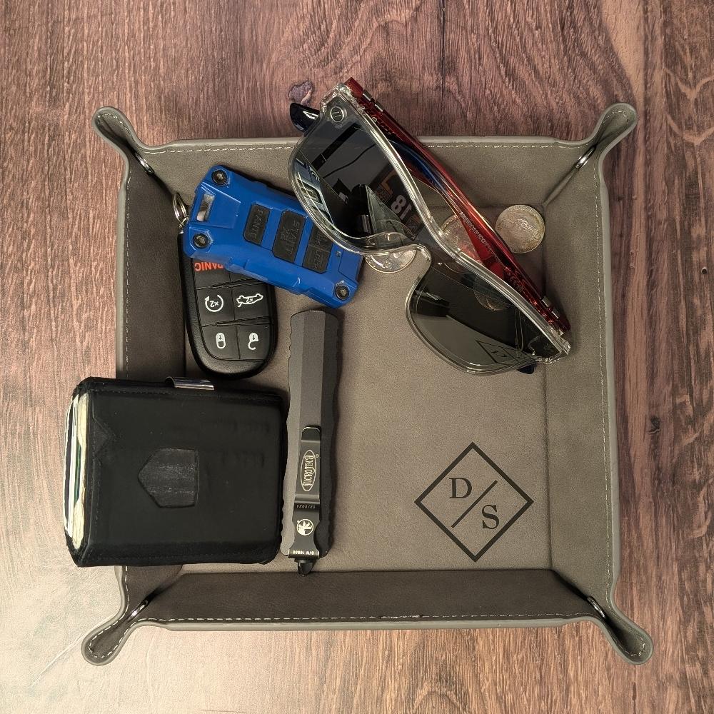 Close up to Valet Tray with organized items in the tray.