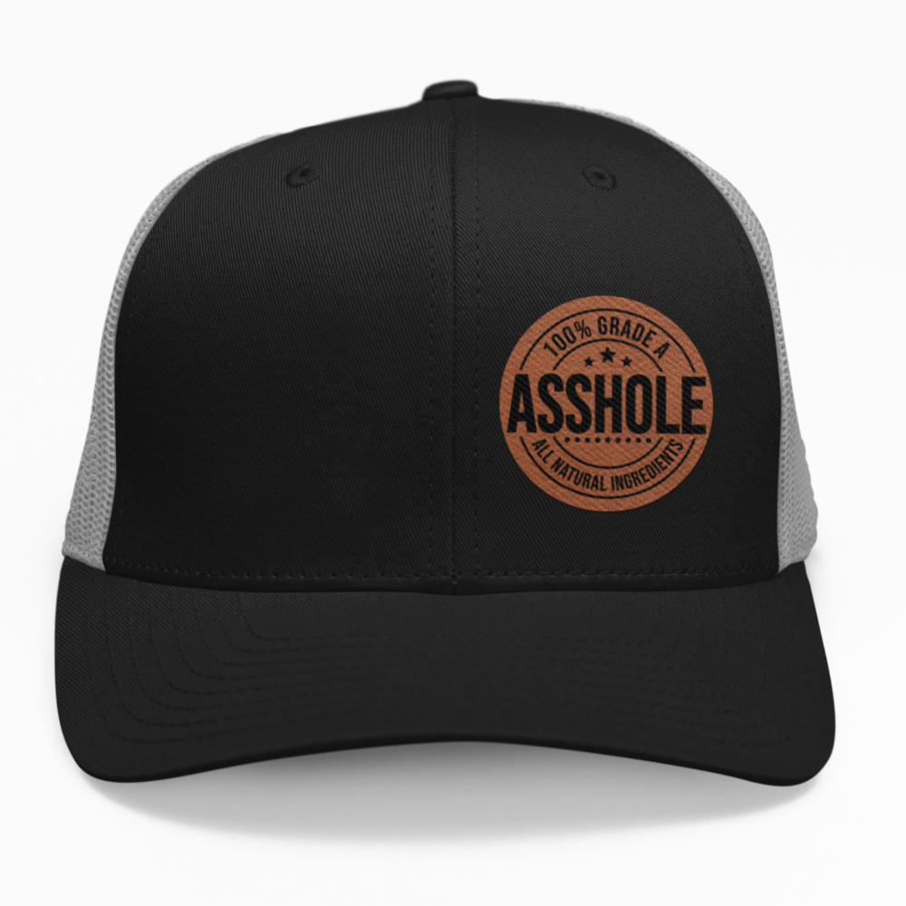 Preview of the '100% Grade A A*Hole' leatherette patch on a custom hat, showcasing the bold and funny design on an adjustable snapback.