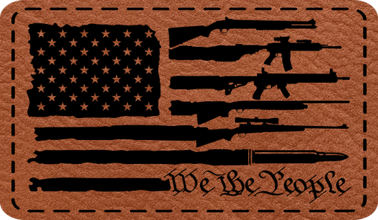 Close-up of the "USA Flag Guns WTP" leatherette patch featuring an American flag with gun stripes and "We The People" on the final stripe.