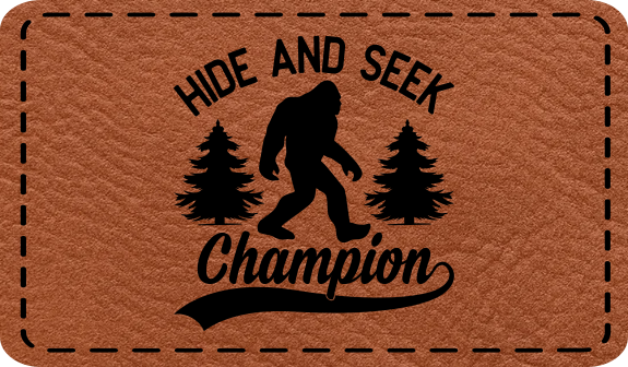 Close-up of the "Hide and Seek Champion" leatherette patch featuring a Bigfoot silhouette.