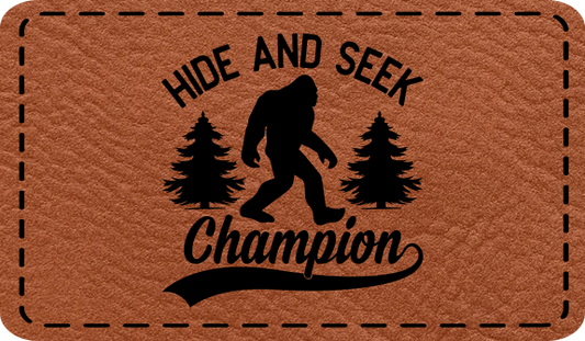 Close-up of the "Hide and Seek Champion" leatherette patch featuring a Bigfoot silhouette.