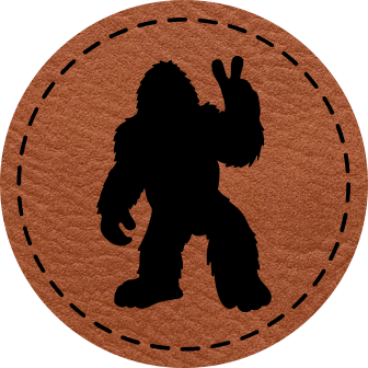 Close-up of the 'Bigfoot Silhouette Peace Sign' leatherette patch, featuring Bigfoot giving the peace sign for a fun, laid-back look.