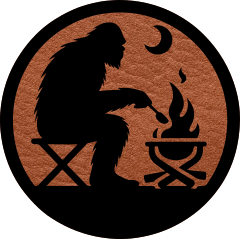 Close-up of the 'Bigfoot by the Campfire' leatherette patch featuring Sasquatch sitting by a campfire, ideal for outdoor lovers.