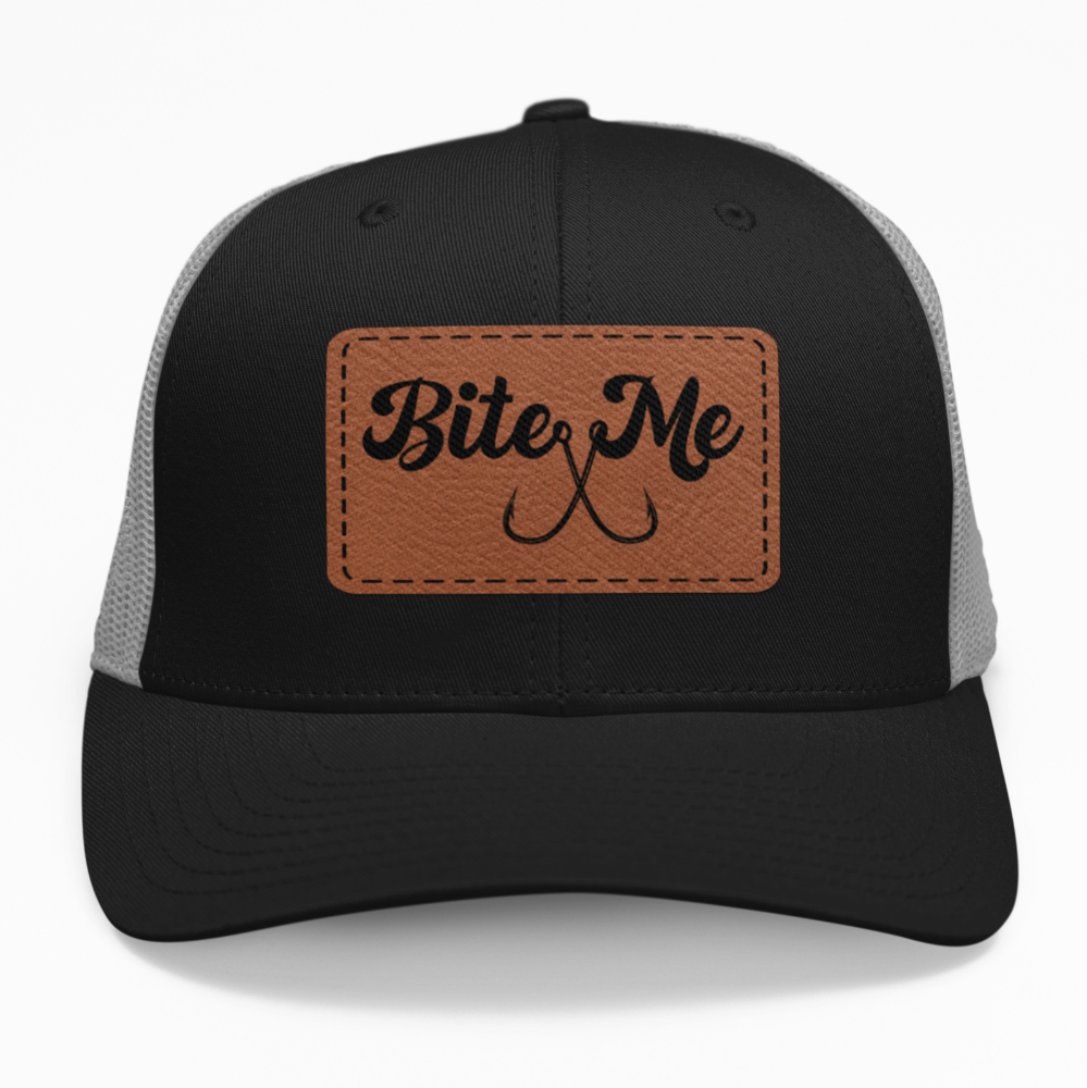 Preview of the 'Bite Me' leatherette patch on a custom hat, showcasing the fun and fish-themed design on an adjustable snapback.