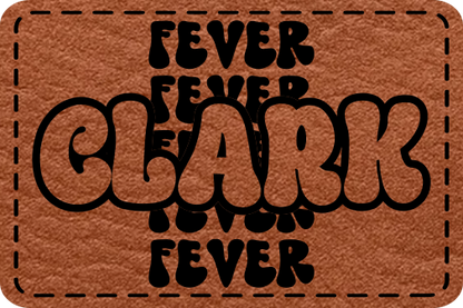 Close-up of the Clark Fever Retro Hat leatherette patch featuring 'Fever' repeated in the background with 'Clark' in the center in a vintage font.