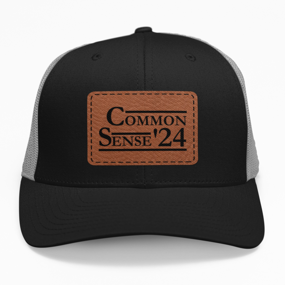 Preview of the Common Sense '24 presidential leatherette patch on a custom hat, available in snapback or fitted styles.