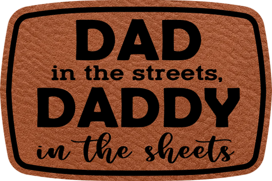 Close-up of the "Dad in the Streets, Daddy in the Sheets" leatherette patch with humorous text.