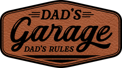 Close-up of the "Dad's Garage Dad's Rules" leatherette patch, featuring bold text and a fun design.