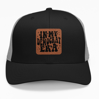 Preview of the "In My Democrat Era" retro wavy font leatherette patch on a custom hat.