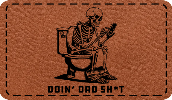 Close-up of the "Doin' Dad Sh*t" leatherette patch featuring a skeleton on a toilet looking at a phone.