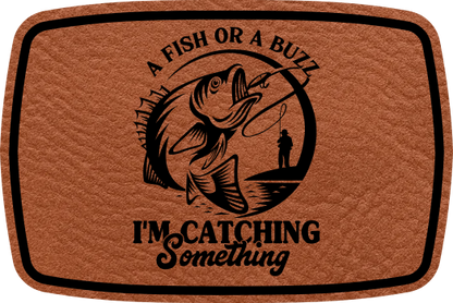 Close-up of the "A Fish or A Buzz, I'm Catching Something" leatherette patch with a humorous fishing theme.