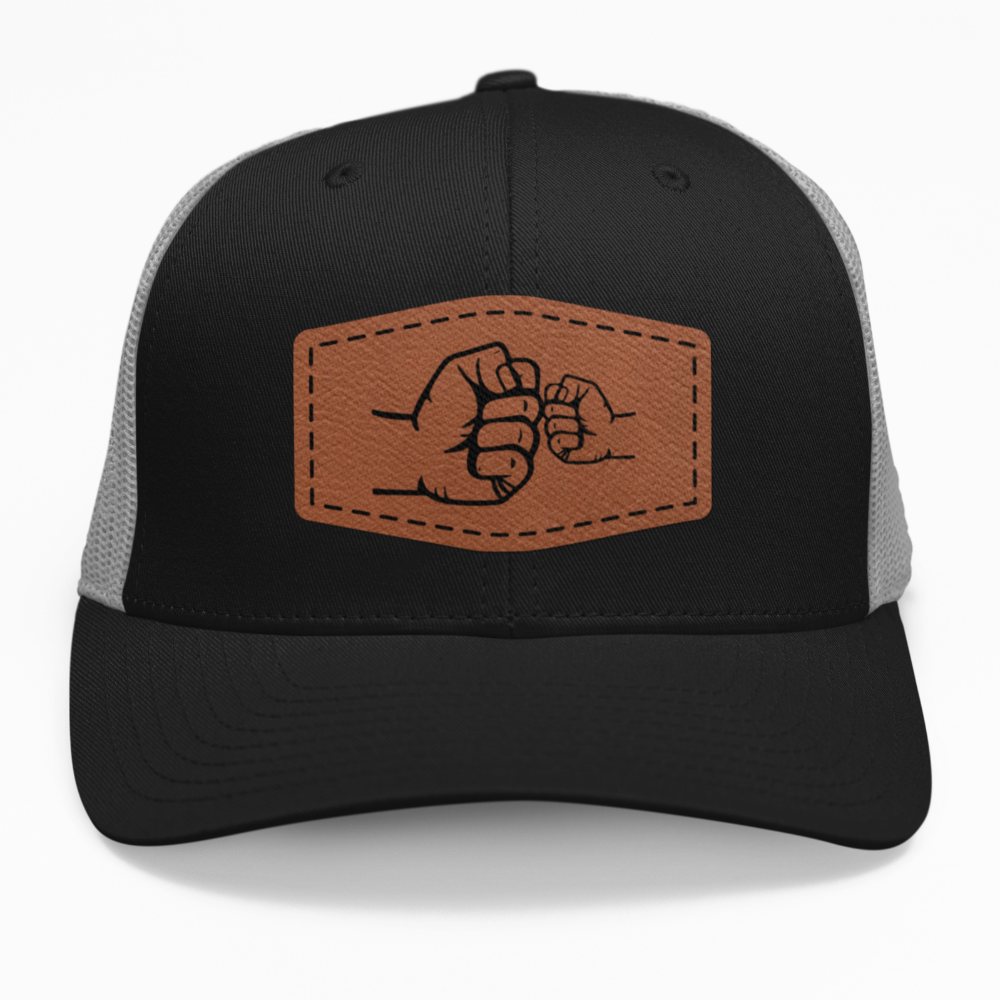 Preview of the "Dad and Son Fist Bump" leatherette patch on a custom hat.