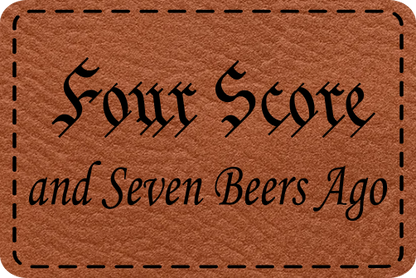 Close-up of the "Four Score & 7 Beers Ago" leatherette patch featuring bold text and a humorous beer theme.