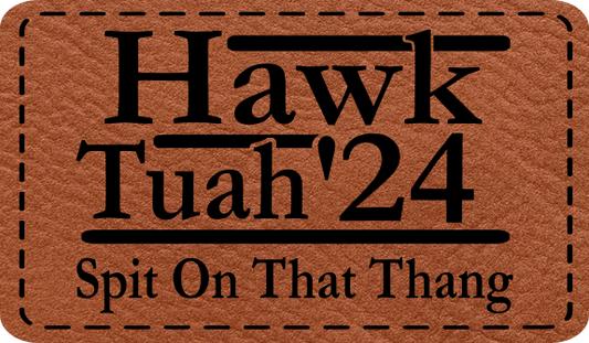 Close-up of the "Hawk Tuah '24" leatherette patch with viral slogan design.