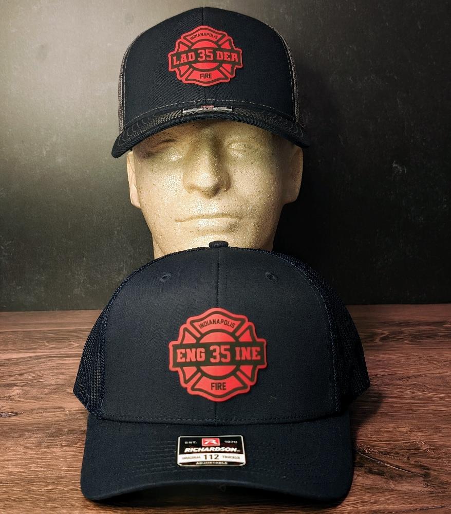 Close up to the Custom Fire department hat patches on a hat. 