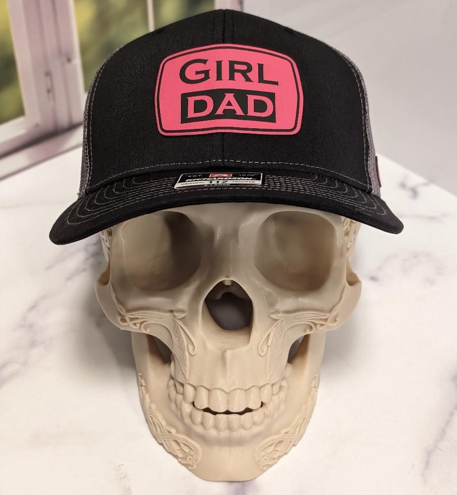 Close up of Girl Dad Patch on a hat. 