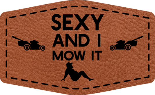 Close-up of the "Sexy and I Mow It" leatherette patch featuring playful text.