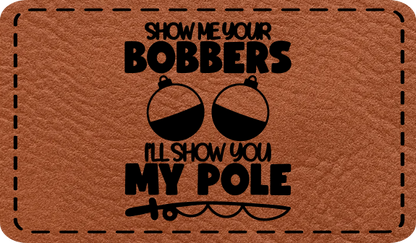 Close-up of the "Show Me Your Bobbers, Show My Pole" leatherette patch featuring humorous fishing-themed text.