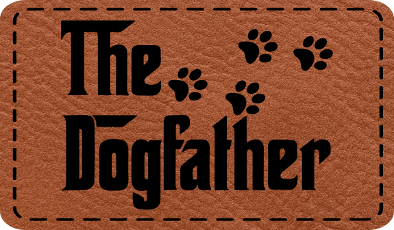 Close-up of the "Dog Father" leatherette patch featuring a playful design with paw prints.