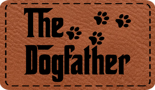 Close-up of the "Dog Father" leatherette patch featuring a playful design with paw prints.