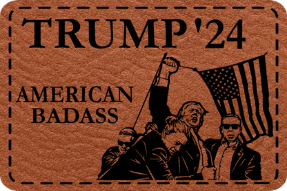 Close-up of the "American Badass" leatherette patch featuring Trump raising his fist in front of the American flag, surrounded by secret service.