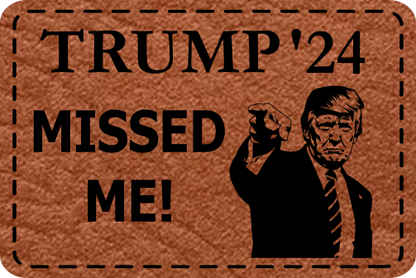 Close-up of the "Trump 2024 Missed Me" leatherette patch featuring Trump pointing and humorous text.