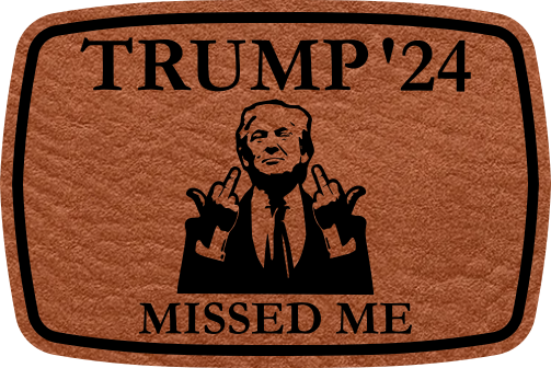 Close-up of the "Missed Me" leatherette patch featuring Trump’s message and middle finger.