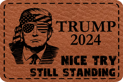 Close-up of the "Nice Try. Still Standing" leatherette patch featuring Trump with aviators and American flags in the lenses.