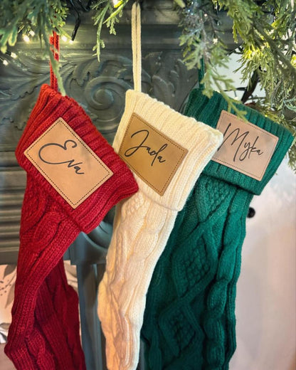 Close-up of the Personalized Knit Christmas Stocking, showcasing the classic cable knit pattern and engraved name patch.